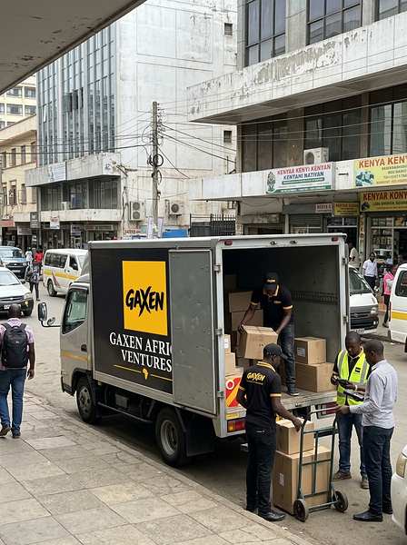 GAXEN delivery truck unloading boxes on a city street